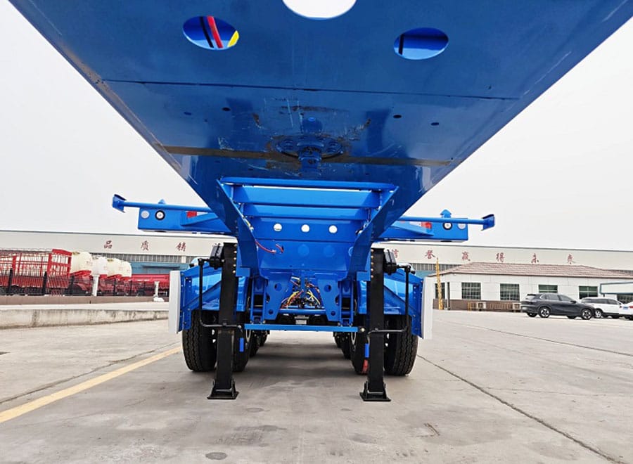 Underside of a container chassis showing kingpin area and support legs