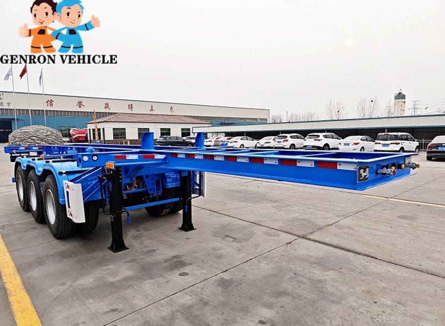 Blue empty container chassis showing its frame, axles and landing legs