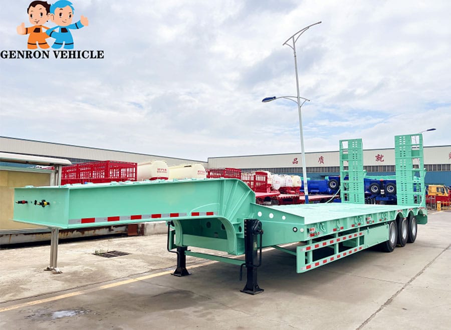 Side and front view of a green low bed trailer