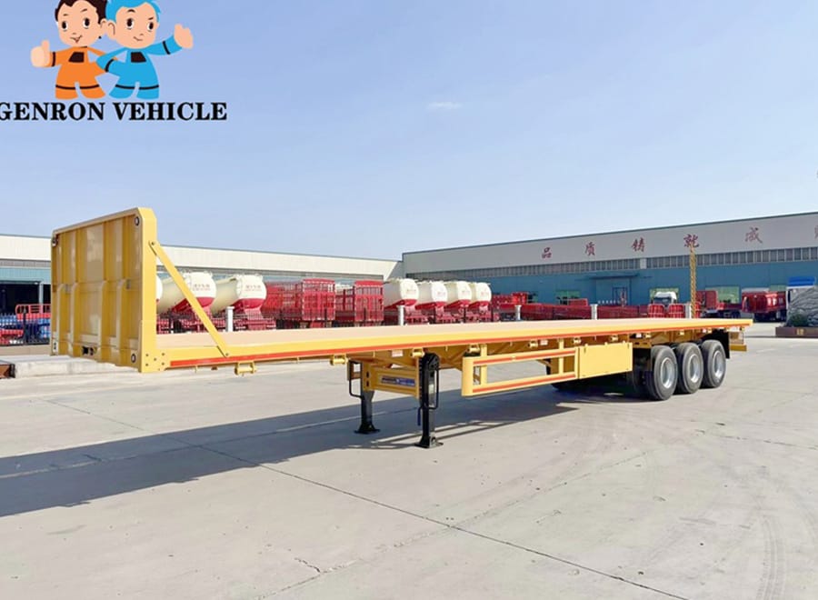Yellow flatbed semi trailer viewed from the front quarter