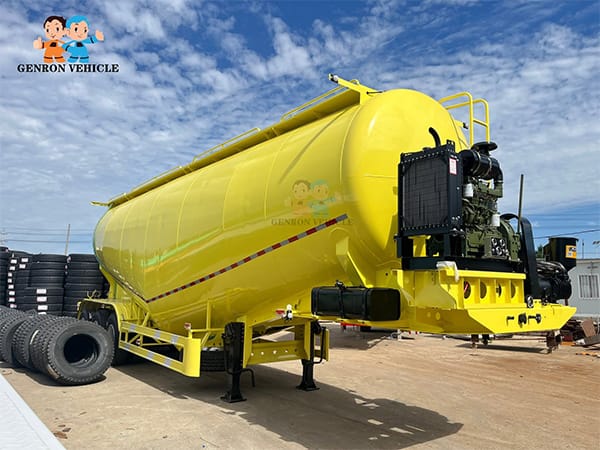 Yellow bulk cement tanker with front-mounted equipment